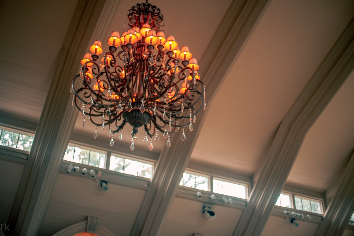 Ornate chandelier in a vaulted ballroom