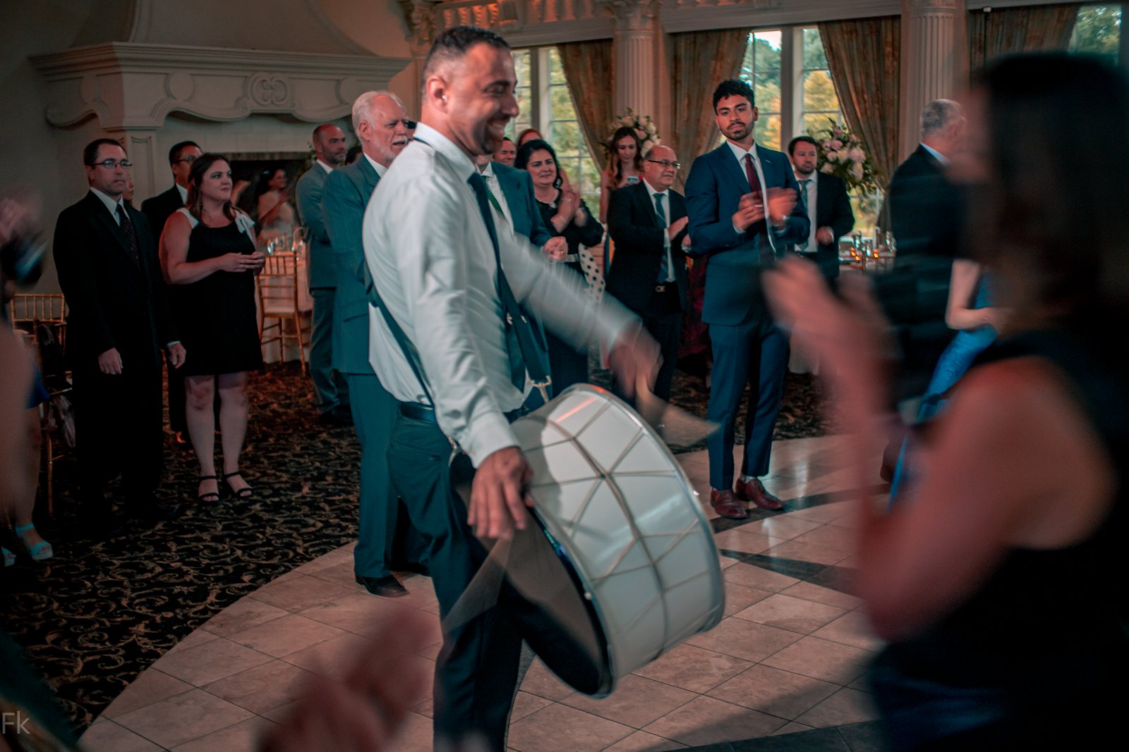 Guests dancing together on a wedding dance floor